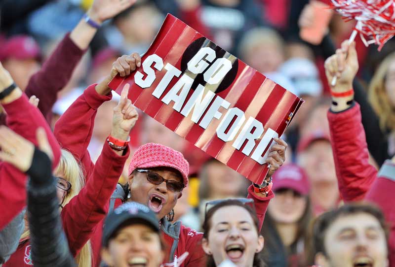 Fans with 'Go Stanford' sign