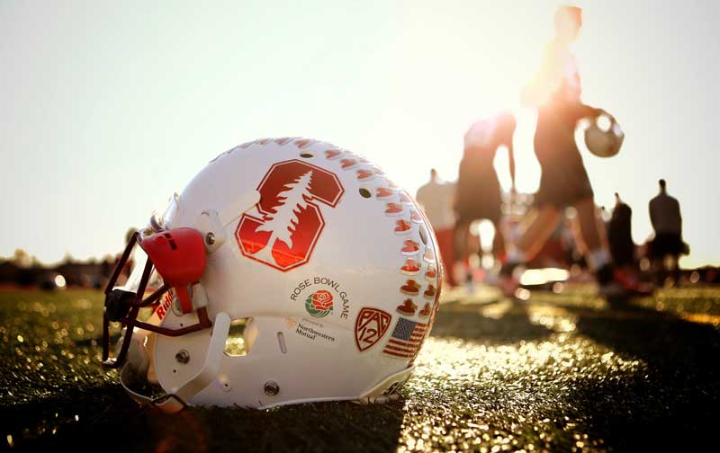 Stanford football helmet sitting on the field