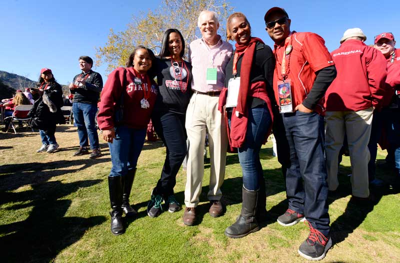 Five people smiling at the camera