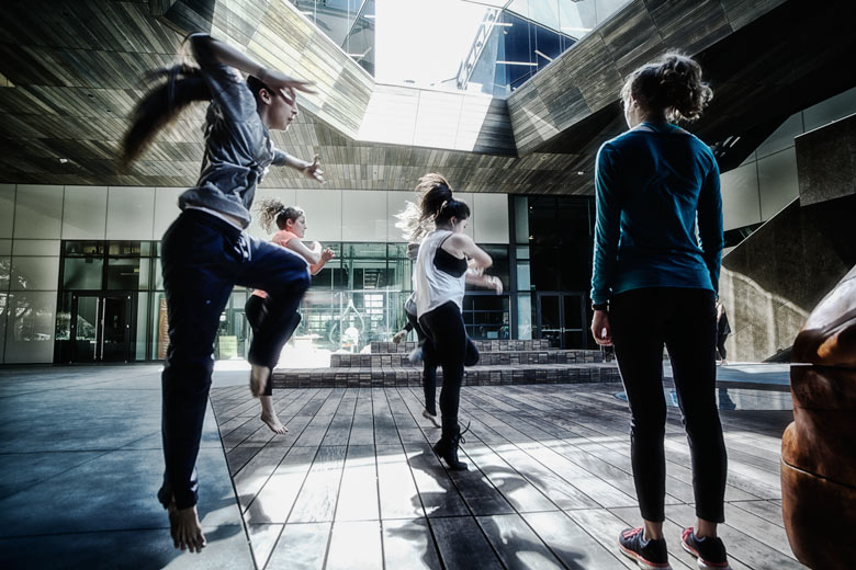 dancers rehearsing in courtyard of McMurtry Building