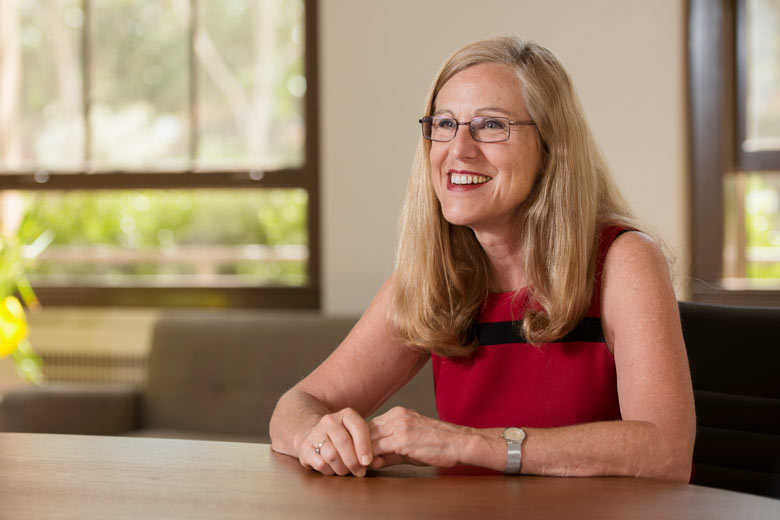 Deborah Stipek sitting at a desk