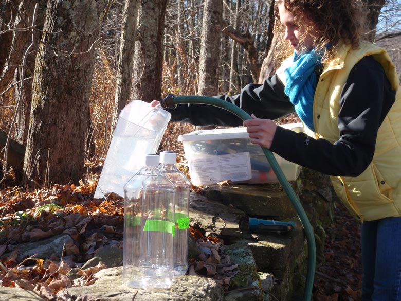 Technician collects drinking water