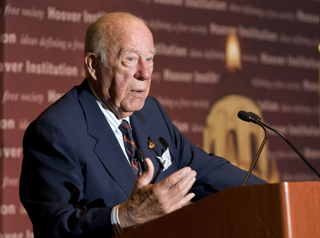 George Shultz at podium