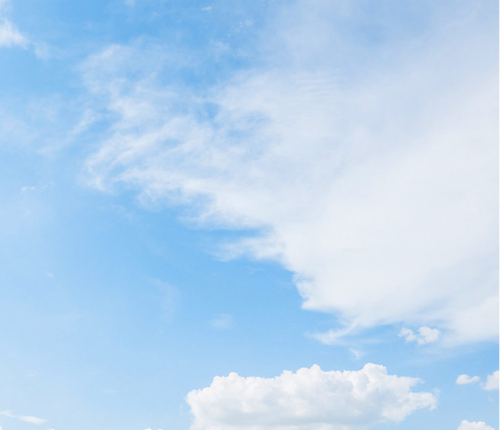 Photo of blue sky with white clouds.