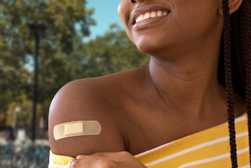 Person with bandage on upper arm