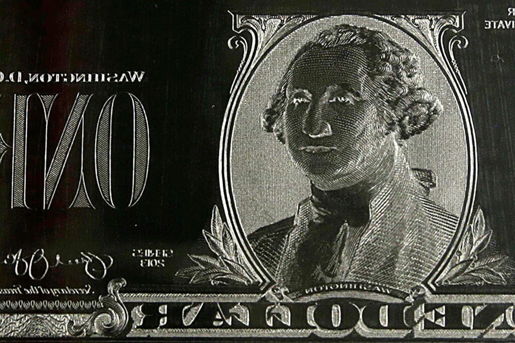 The image of United States President George Washington is seen on an engraving plate for a US one dollar bill.