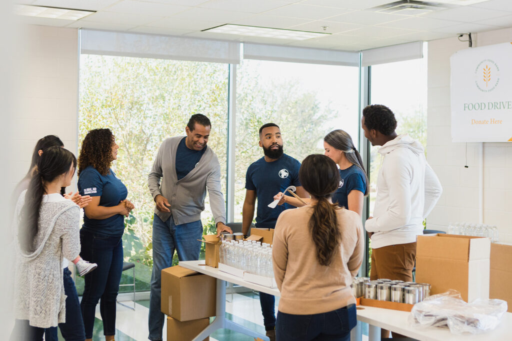 Several volunteers working together at a food bank.