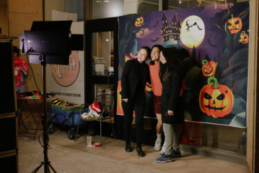 Students at a photo booth at Tresidder