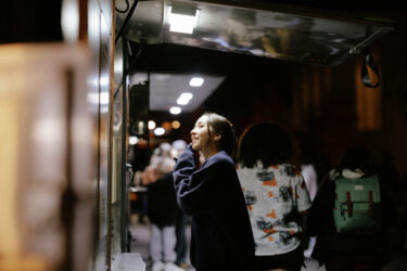 Student ordering from a food truck