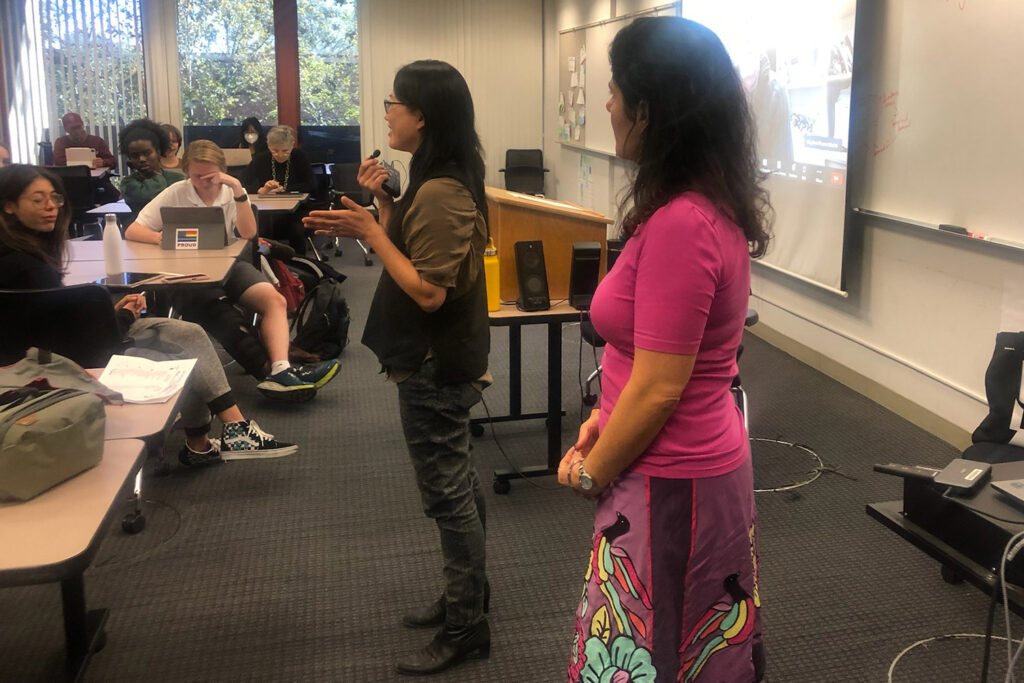 Artist Jean Shin (left) and pediatrics professor Desiree LaBeaud speak to Human and Planetary Health class.