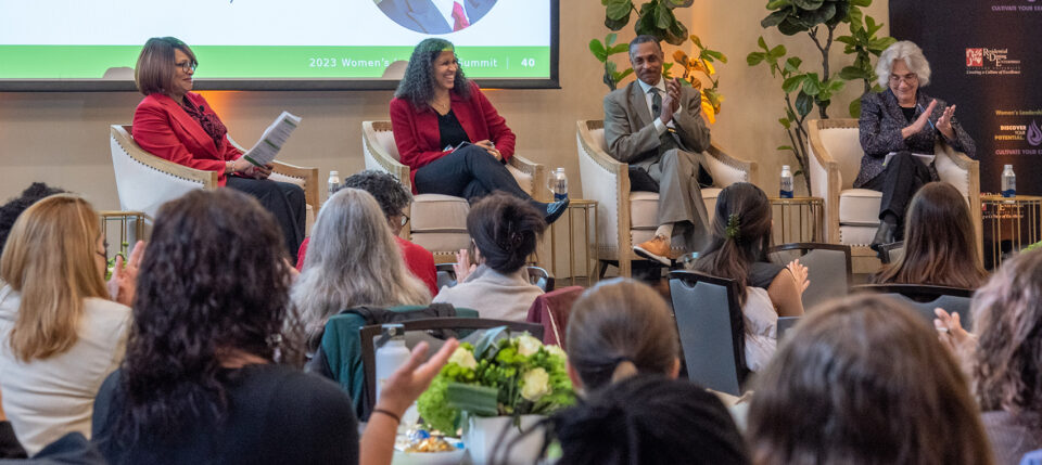 Shirley Everett leads panelists Ayodele Thomas, Patrick Dunkley, and Provost Persis Drell in a discussion about the value of inclusive leadership at the Women's Leadership Summit.