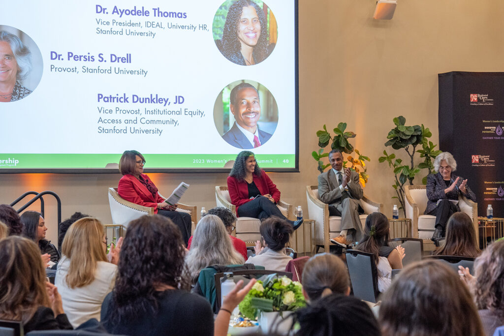 Shirley Everett leads panelists Ayodele Thomas, Patrick Dunkley, and Provost Persis Drell in a discussion about the value of inclusive leadership at the Women's Leadership Summit.