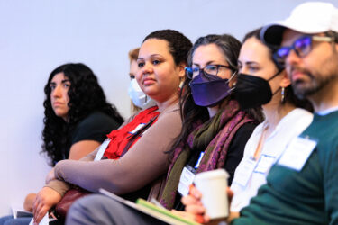 Attendees listening to panel.