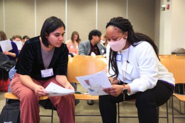 Attendees in conversation.