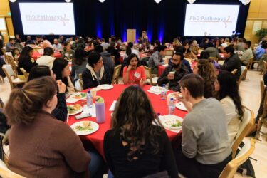 Attendees seated and talking.