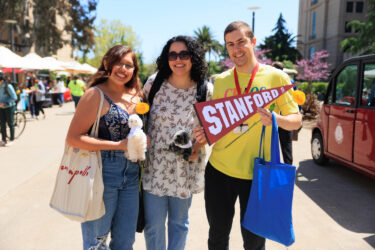 Three students in a group shot.