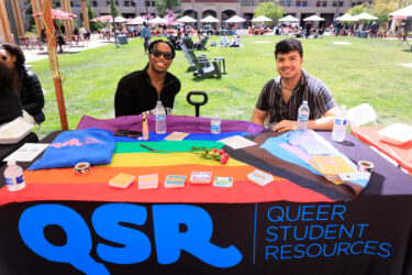 Two staff members sitting at a table.