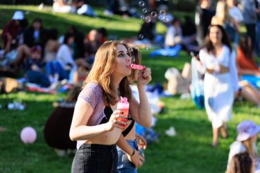 Audience member blowing bubbles