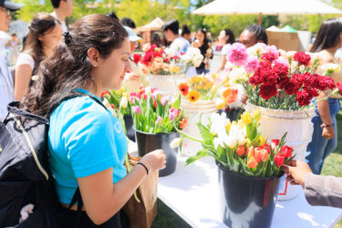 Student receiving flowers.