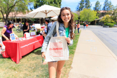 Student with tote bag.