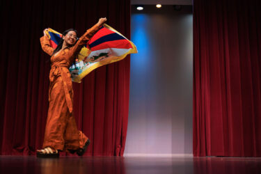 Student carrying Tibet flag.