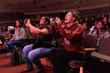 Audience members.