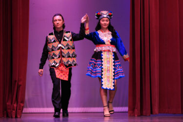 Two models in traditional attire.