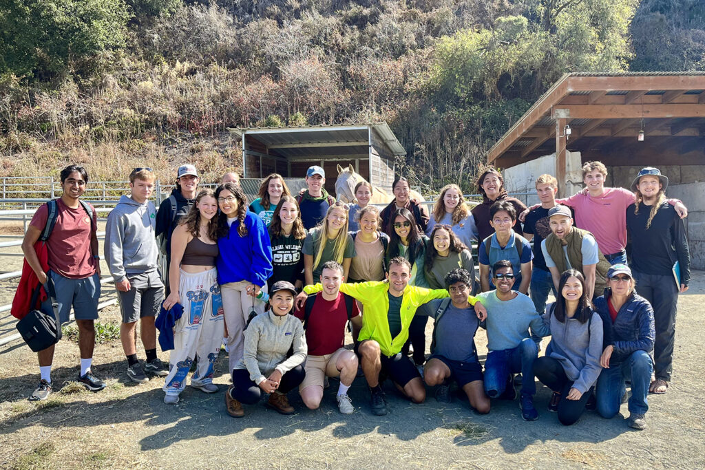 Residents from the Outdoor House pose for a group photo during a trip learning about regenerative ranching at the TomKat Ranch, an 1,800-acre grass fed cattle ranch in Pescadero, California.