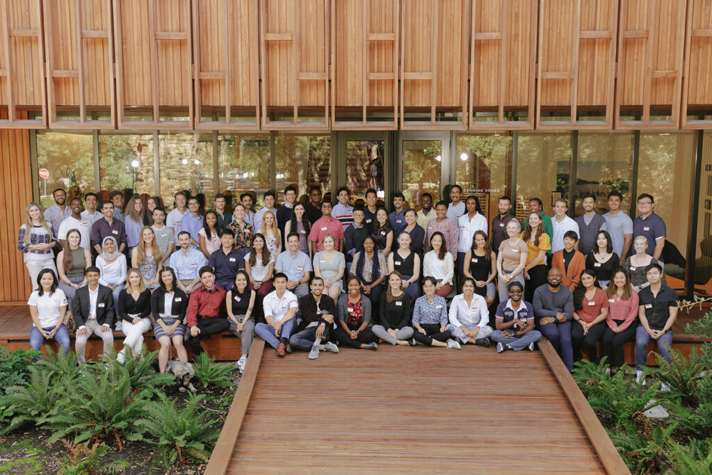 The 2022 cohort of Knight-Hennessy Scholars gathered in front of Denning House.