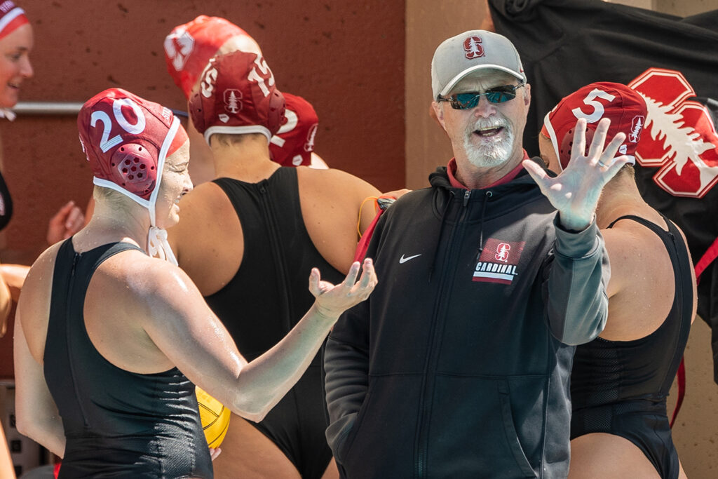 Women’s water polo coach John Tanner with team members