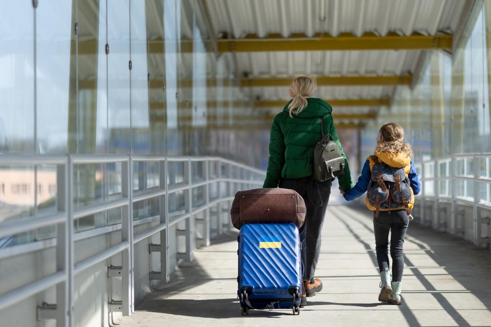 Ukrainian mother and daughter in airport