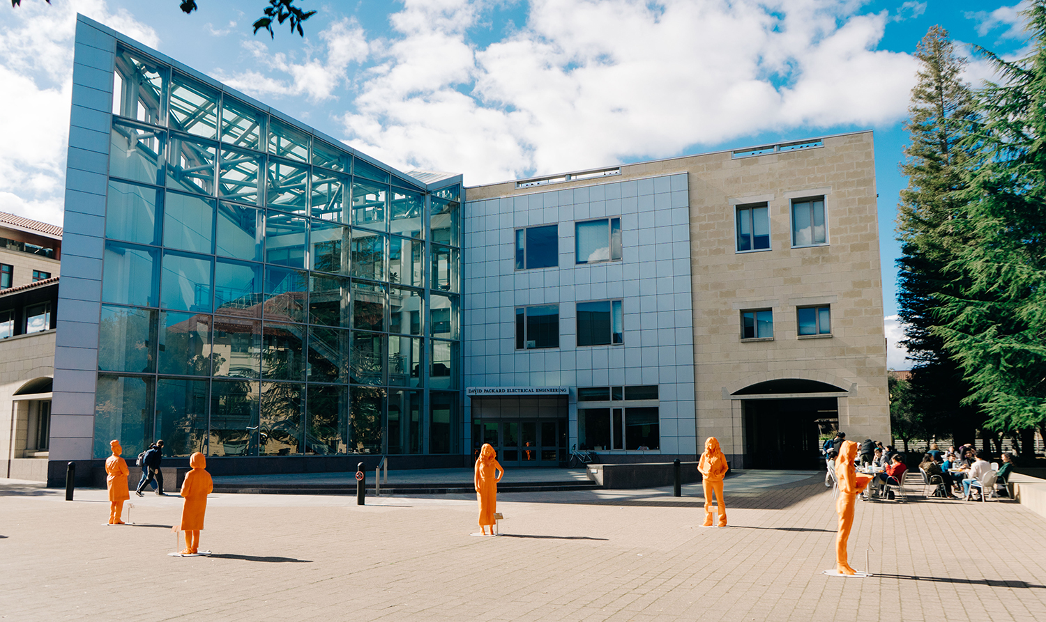 Five life-size, bright orange statues of contemporary STEM women innovators and role models affiliated with Stanford on display between the Hewlett Teaching Center and the Packard Electrical Engineering Building as a satellite installation of IfThenSheCan – The Exhibit.