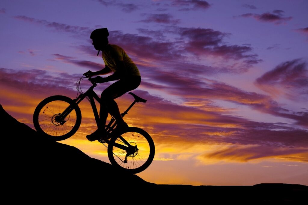 Man riding a bike uphill