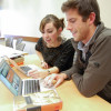 Two students looking at a computer. / Photo: Corrie Goldman