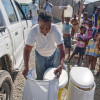 Residents of Cap Haitien, Haiti receive portable dry household toilets / Felipe Jacome