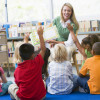 teacher reading to kindergarten class / Monkey Business Images/Shutterstock