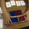 elementary students using hinged tool to study symmetry between positive and negative numbers / Courtesy AAALab@Stanford