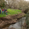 Professor and students on the bank of a small creek. / Photo: L.A. Cicero