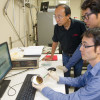 Three researchers around a computer screen. Photo: Norbert von der Groeben