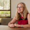 Deborah Stipek sitting at a desk / L.A. Cicero