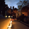 Students lighting candles at vigil/ Photo: Tamer Shabani