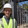 Sebastien Tilmans in front of the William and Cloy Codiga Resource Recovery Center. / Photo: Kate Chesley