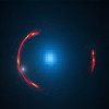 Composite image of the gravitational lens SDP.81 showing distorted image of the more distant galaxy and the nearby lensing galaxy