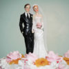 bride and groom figures atop wedding cake