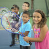 Children learning tennis