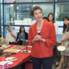 Carla Shatz and members of her lab celebrate her Kavli Prize with cake and champagne