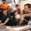 Stanford students and their robots