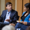 Panelists Michael Rezendes of the Boston Globe and Mary Rajkumar of the Associated Press in discussion on stage at reunion of journalism fellows