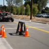 researchers testing autonomous vehicle on a street course