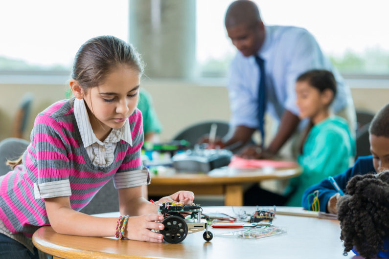 Girl in robotics class